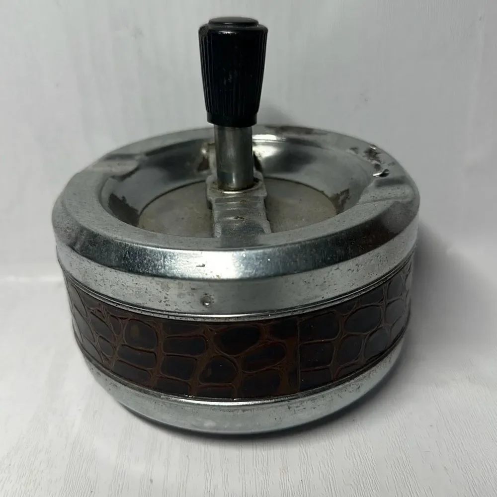 Gold Coin Metal ashtray with a snake-like pattern with a twist Made in Hong Kong